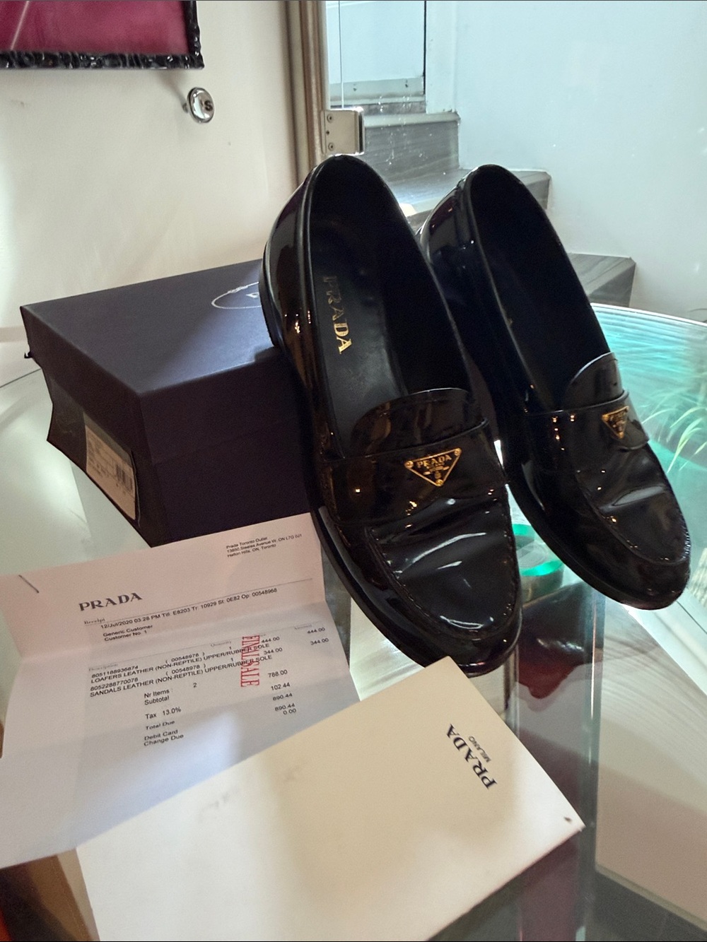 Prada Black Patent Leather Penny Loafers with Gold Triangle Logo